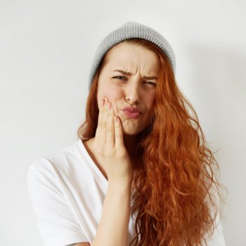 Redhead girl tooth pain Emergency Dental Care in   Acworth image