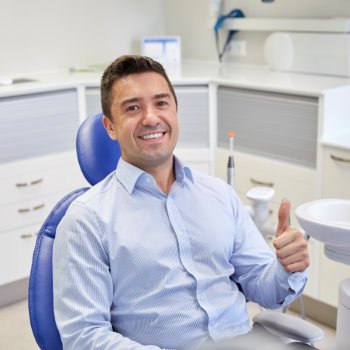 Satisfied man thumbs up in chair Dental Care   Acworth visit