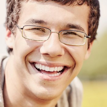 Young man with glasses smiling Dental Care   Acworth patient